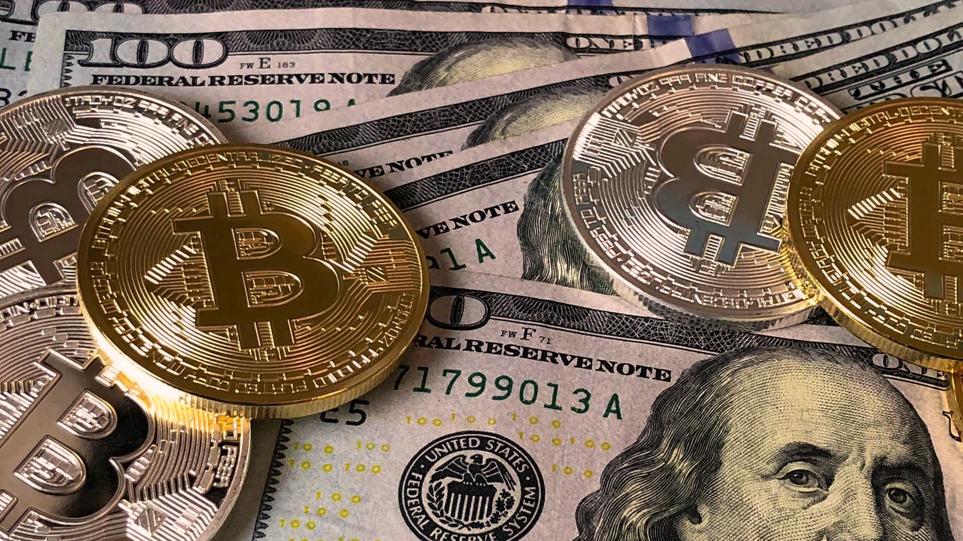 cuantos bitcoins son un dolar